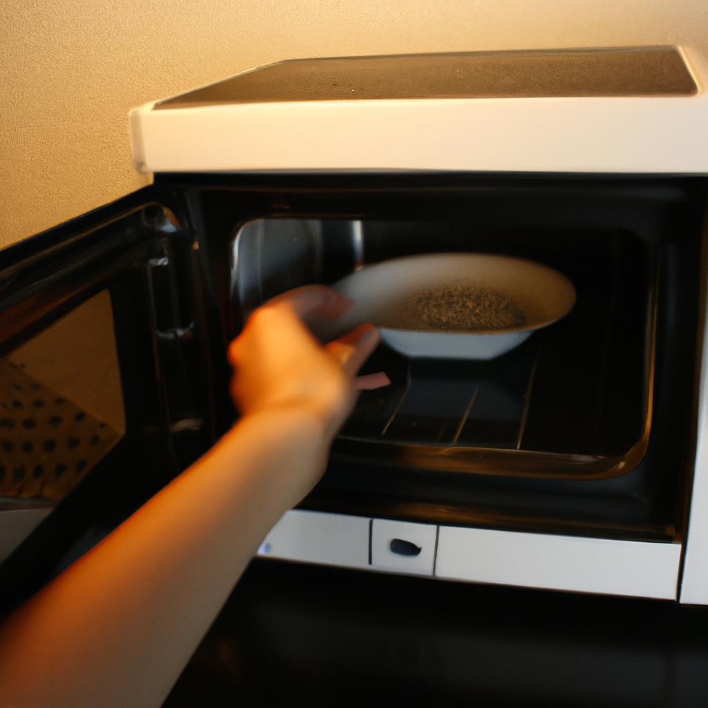 Person operating a microwave oven